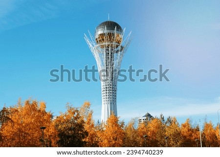 Baiterek monument with a golden ball observation platform against the blue sky on a sunny autumn day. Kazakhstan, Astana 14.10.2022.