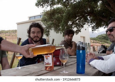 Baja California, MEXICO - APRIL 29, 2019: Men From Various Nations In Bichi Vineyard Tasting Sparkling Wine