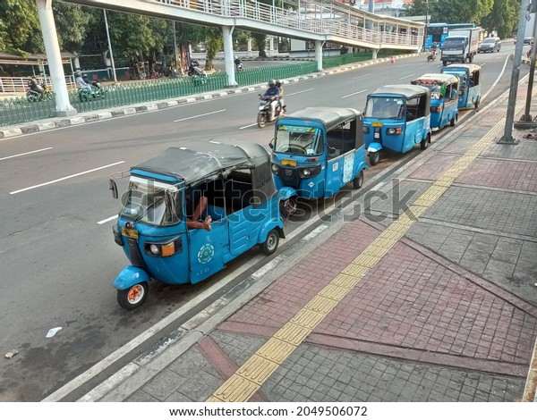 Bajaj, a traditional\
and iconic public transportation in Jakarta, Capital city of\
Indonesia (September\
2021)