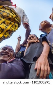 BAJAWA, INDONESIA - MAY 19: Unidentified People In A Crowd Watching A Traditional Boxing Match Near  Bajawa In East Nusa Tenggara, Indonesia On May 19, 2017. 