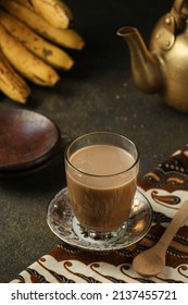 Bajigur is a traditional Bandung hot drink, made from processed coconut milk, brown sugar and boiled ginger, served in a glass,selective focus