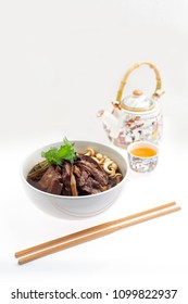 Bak Kut Teh, Pork soup with Chinese herb and tea pot on background.