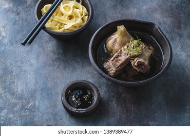 Bak kut teh or Tender pork ribs in herbal soup, asian cuisine, copy space