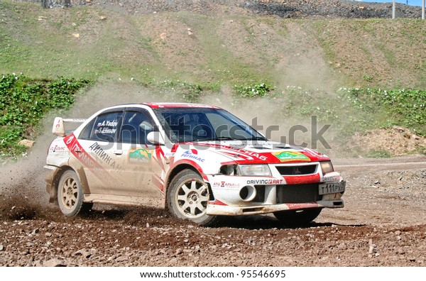 BAKAL,\
RUSSIA - AUGUST 8: Andrey Yadov\'s Mitsubishi Lancer Evolution (No.\
12) competes at the annual Rally Southern Ural on August 8, 2008 in\
Bakal, Satka district, Chelyabinsk region,\
Russia.