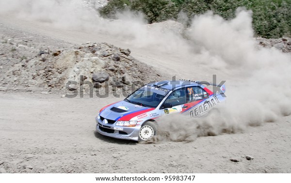 BAKAL, RUSSIA - JULY 9: Alexander Rogozin\'s\
Mitsubishi Lancer Evolution IX (No. 31) competes at the annual\
Rally Southern Ural on July 9, 2011 in Bakal, Satka district,\
Chelyabinsk region,\
Russia.