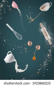 Bake Goods, Ingredients Fly Around On Green, Blue Background, Concept Baking Chaos, Baking In The Kitchen, Photo Manipulation