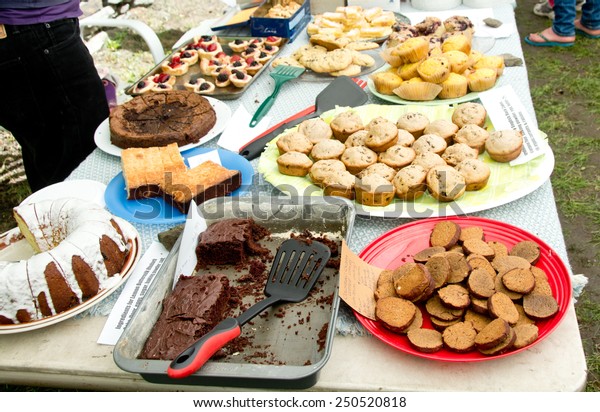 A bake sale is in full progress. All items for\
sale have been labeled with ingredients for the benefit of those\
with food allergies.