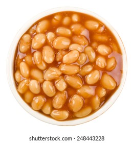 Baked Beans - Bowl of baked beans in tomato sauce isolated on a white background.