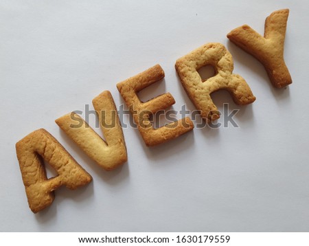 baked biscuits with shape of letters forming the name Avery