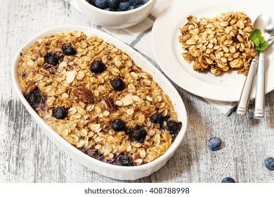 Baked Blueberry Oatmeal - Healthy Breakfast With Oats Nuts And Blueberries, Selective Focus