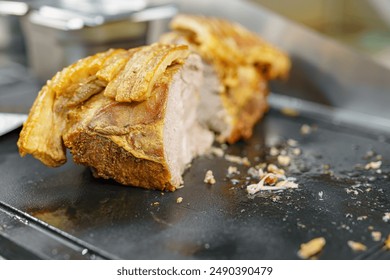 Baked boiled pork in the oven for preparing a dish in a restaurant. - Powered by Shutterstock