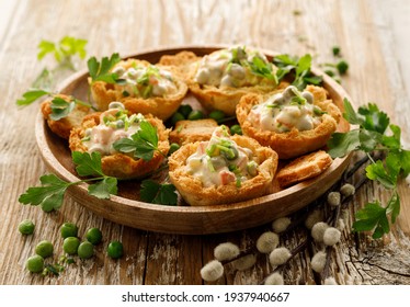 Baked bread cups filled with vegetable and mayonnaise salad.     An idea for serving an Easter vegetable salad