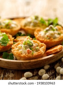 Baked bread cups filled with vegetable and mayonnaise salad, close up view. An idea for serving an Easter vegetable salad