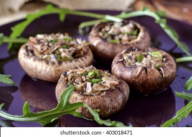 Baked brown mushrooms stuffed with ham, garlic, mushrooms, onion and parsley