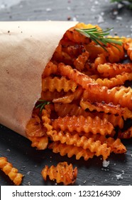 Baked Butternut Squash Fries With Sea Salt And Rosemary In Paper Cone. Pumpkin Chips