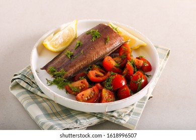 Baked Catfish With Salad Served On Plate