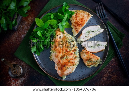 Baked chicken breast stuffed with cheese and spinach, horizontal