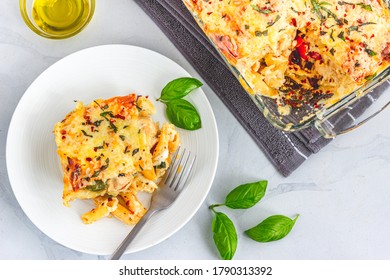 Baked Chicken Pasta, Traditional Italian Food, Slice Of Baked Pasta On A Plate Top Down Photo