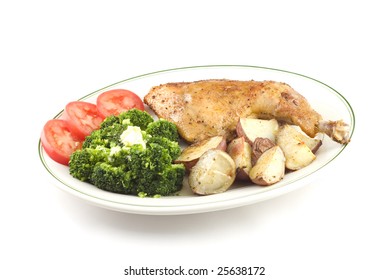 Baked Chicken With Steamed Broccoli  And Roasted Red Skinned Potatoes Isolated On White Background Copy Space