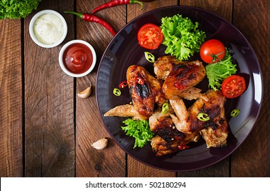 Baked Chicken Wings In The Asian Style On Plate. Top View