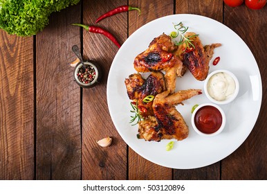 Baked Chicken Wings In The Asian Style On Plate. Top View