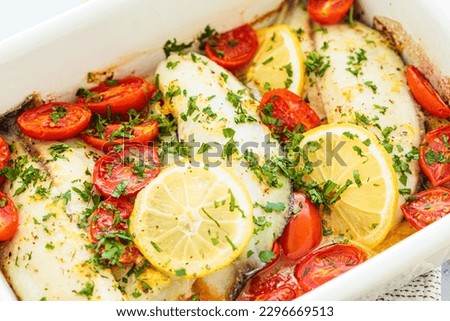 Baked cod fillet with cherry tomatoes and butter. Healthy diet recipe. Foto d'archivio © 