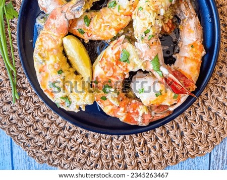 BAKED COLOSSAL SHRIMP WITH LEMON GARLIC BUTTER SAUCE- It's the fastest, easiest, fancy dinner you'll find anywhere! Succulent baked colossal shrimp will