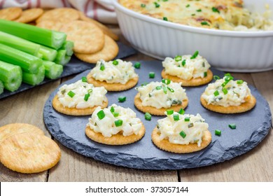 Baked crab dip, served with celery sticks and crackers, top view