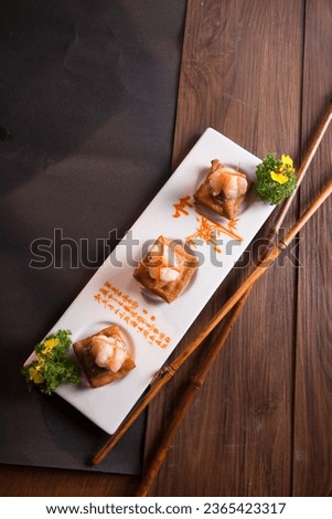 baked deep fried bbq tofu bean curd bread toast with prawn canapés butler sushi appetiser on wood table tea pot asian Chinese halal food restaurant banquet cuisine menu