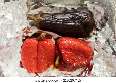 Baked Eggplant And Red Bell Pepper In The Foil Baking Dish. Grilled Vegetables Concept