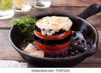 baked eggplants and tomatoes in slices portion