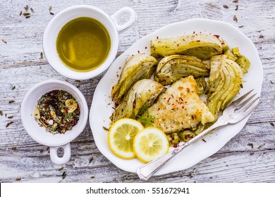 Baked Fennel With Herbs And Olive Oil Served With Fried Fish. 
