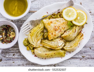 Baked Fennel With Herbs And Olive Oil Served With Fried Fish.