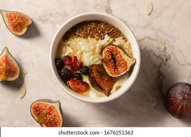 Baked Figs On Honey Yogurt, Sliced Almonds And Toasted Flax Seed With A Drizzle Of Butter-honey-cinnamon Syrup