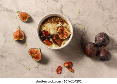 Baked Figs On Honey Yogurt, Sliced Almonds And Toasted Flax Seed With A Drizzle Of Butter-honey-cinnamon Syrup