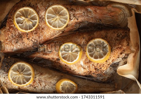 Baked fish in a baking dish close up
