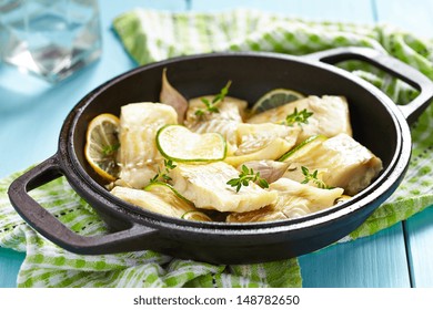 Baked Fish Fillet With Lemon, Lime, Garlic And Themy