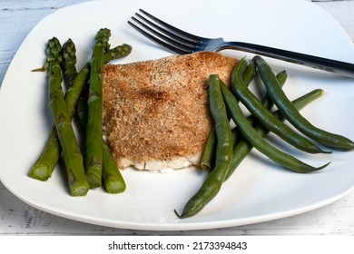 Baked Haddock Served With Asparagus And Green Beans