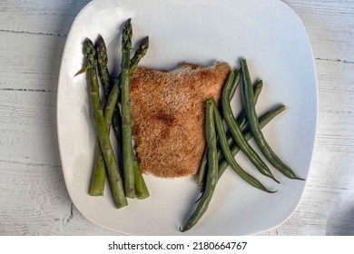 Baked Haddock Served With Asparagus And Green Beans