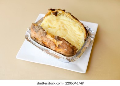 Baked kumpir potato stuffed with the cheese, sausage, olives, peppers and corn. Turkish baked potato with butter, cheese, chicken, barbecue sauce and spices. This kumpir is traditional turkish food . - Shutterstock ID 2206346749