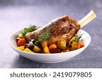 baked lamb leg with potatoes and carrots