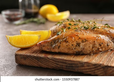 Baked Lemon Chicken With Thyme Served On Grey Marble Table