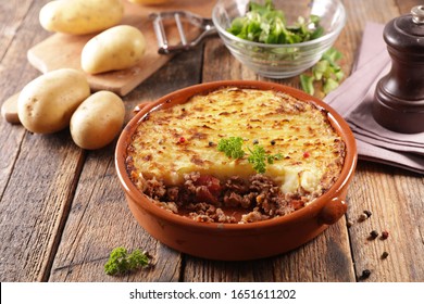 baked mashed potato with minced beef and salad