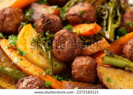 Baked meatballs with Roasted vegetables, potato, carrots, tenderstem broccoli and onions
