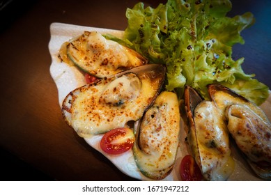 Baked Mussels With Cheese On Fan Shape Plate