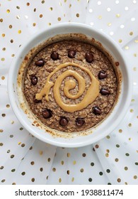 Baked Oats Topped With Chocolate Chips And Peanut Butter.