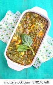 baked omelette with spinach in a white rectangular shape