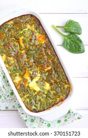 baked omelette with spinach in a white rectangular shape
