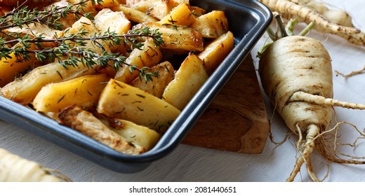 Baked Parsnip Close-up View. Roasted Root Vegetable With Thyme Herb.