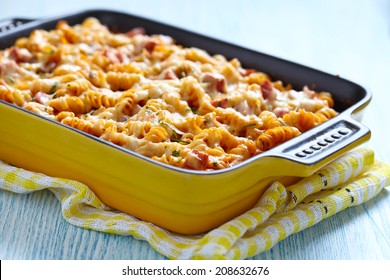 Baked pasta with ham and cheesy tomato sauce